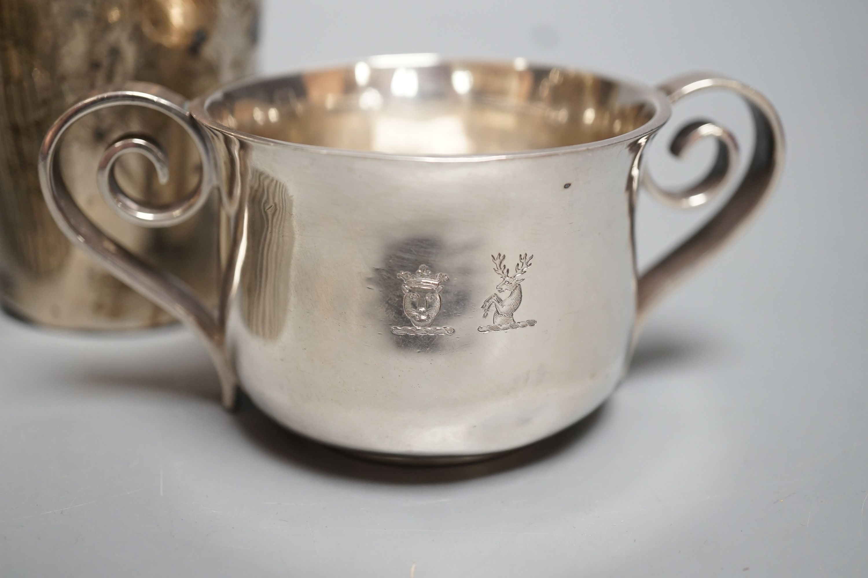 A George III engraved silver goblet, maker's mark rubbed, London, 1784, 14.6cm, together with an Edwardian silver tea caddy, a Victorian goblet, silver beaker and Brittania standard two-handle bowl by George Perkins, Lon